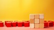 © Nayyab - Inspiration and innovation: red wooden cube and business strategy concept on vibrant yellow background - creative entrepreneurial vision for success