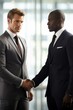 © duyina1990 - Two businessmen in suits shaking hands