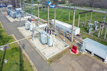 Wall Mural - Aerial view of electrical towers and large electrical substation in spring