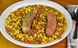 baked beans, corn and peas  served with italian sausage