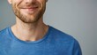 Close up portrait of young smiling handsome guy in blue t-shirt isolated on gray background hyper realistic 