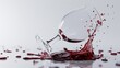   A pair of wine glasses rests atop a table, their contents spilling over