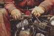 Close-up of hands fixing a motorcycle engine