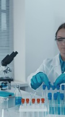 Fototapete - In the laboratory, an experimental geneticist modifies the genomes of organisms to study their functions and properties. An immunologist scientist studies the immune system to develop new treatments