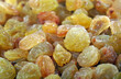 golden raisin background. dried grapes. close up