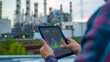 © Maksym - Close-up: Analyst examines nuclear plant metrics on tablet.