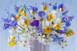 Bouquet of spring flowers pansies, primroses, muscari, bird cherry, scilla in a vase on a blue background, closeup, blur.