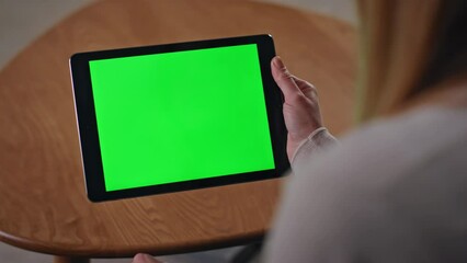 Unrecognizable woman shopping chroma key tablet sitting apartment close up. 