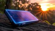 Photo of portable solar charger in sunlight for offgrid energy needs. Concept Solar Power, Off-Grid Living, Renewable Energy, Technology, Portable Chargers