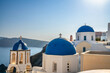 Blue domes and Oia village on Santorini island. Greece
