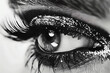The captivating gaze of an eye adorned with glamorous false lashes, captured in high-definition detail.