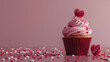 Valentines day theme with cupcake and heart ornament. Valentine cupcake on pink background