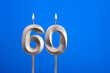 Birthday candle number 60 - Celebration card on blue background