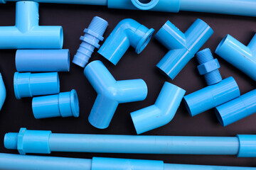 Wall Mural - Plumber equipment with blue pvc pipe connections for plumbing work.