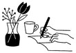 A hand writing something in a notebook and a vase_2