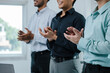 © aksonsat - Group of teamwork businessman are clapping hands to success and archive on business financial and marketing after working on laptop and paperwork in office