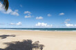 View of a tropical beach with clouds on the horizon in Porto de Galinhas, Brazil.
