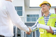 Construction team hands shaking greeting start up plan new project contract in office center at construction site, industry ,architecture, partner, teamwork, agreement, property, contacts.