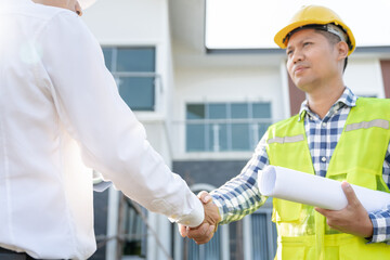 Wall Mural - Construction team hands shaking greeting start up plan new project contract in office center at construction site, industry ,architecture, partner, teamwork, agreement, property, contacts.