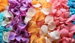 colorful flower petals in a pile, with soft textures and dewdrops, creating an abstract background