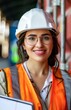 Smiling Female Engineer Wearing Safety Helm and Glasses at Construction Site