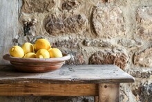 Fresh Lemons In A Rustic Wooden Bowl On A Rough Wooden Table