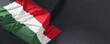 Flag of Hungary. Fabric textured Hungary flag isolated on dark background. 3D illustration