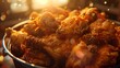 Juicy fried chicken thighs piled high in a bucket, the crispy skin capturing the light in a tantalizing display
