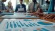 © antusher - a close-up image emphasizing a business meeting in progress with participants analyzing financial reports.