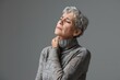 © Ева Поликарпова - A woman with gray hair wearing a turtle neck sweater. Suitable for various lifestyle and fashion concepts