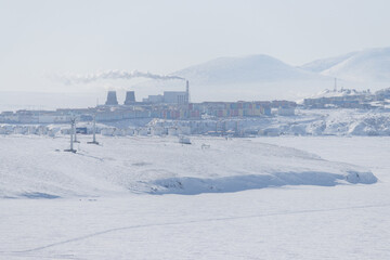 Wall Mural - winter arctic landscape. view of the northern city. anadyr, chukotka, russia. in the foreground are 