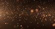 © Anastasika - Abstract background of gold particles. Gold shiny background. gold dust and beautiful bokeh on a dark background..
