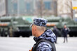 Russian soldier on background of armored vehicles and missile systems of Russia