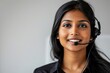 Female Indian Call Center Employee in Black Uniform, White Background - Corporate Services, Customer Care, Global Operations
