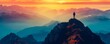 © Svitlana - Silhouette of a man on top of a mountain peak
