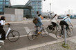 © Maskot - Business professionals cycling on bicycle lane in city