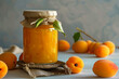 Аpricot jam in glass jar..Homemade apricot jam in a glass jar on a light background