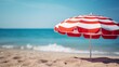 Striped umbrella with chairs on beach background. Summer bunner