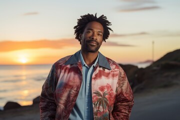 Sticker - Portrait of a glad afro-american man in his 40s wearing a trendy bomber jacket in front of beautiful beach sunset