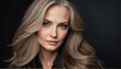 © Arceli - beautiful middleaged female fashion model with flowing long hair close-up portrait posing on plain black background from Generative AI