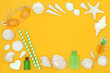 Yellow the color of summer background with vacation beach accessories, symbols and decorations with swimming goggles, body lotion, gel and seashells. Travel, tourism and holiday concept.