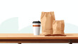 Blank coffee bags and takeaway cup on table against