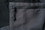 Fototapeta Kuchnia - Drawstring zipper of dark gray outdoor trouser pocket