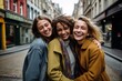© Dina - three female friends  hugging together in the street candid photo. Women supporting each other. Female friendship and love concept.