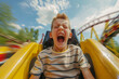 © Lazy_Bear - Young boy screaming with excitement on roller coaster ride at amusement park. Child gets an adrenaline rush on exciting ride