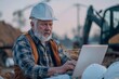 © senyumanmu - Mature architect working on laptop in construction area