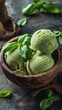 wooden bowl with green basil ice cream on background, in a closeup view, copy space concept for summer food and menu design
