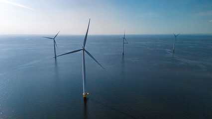 Wall Mural - A group of wind turbines stand tall, floating gracefully in the ocean, harnessing the power of the wind to generate clean energy