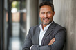 © ArtCraft - Confident middle-aged businessman leaning against a wall. Portrays professionalism and success, ideal for corporate profiles, websites, and editorial use
