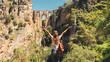 Happy female tourist enjoying view of famous bridge in touristic village of Ronda in Spain- Province of Malaga
